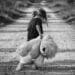 a child walking away with her stuffed toy
