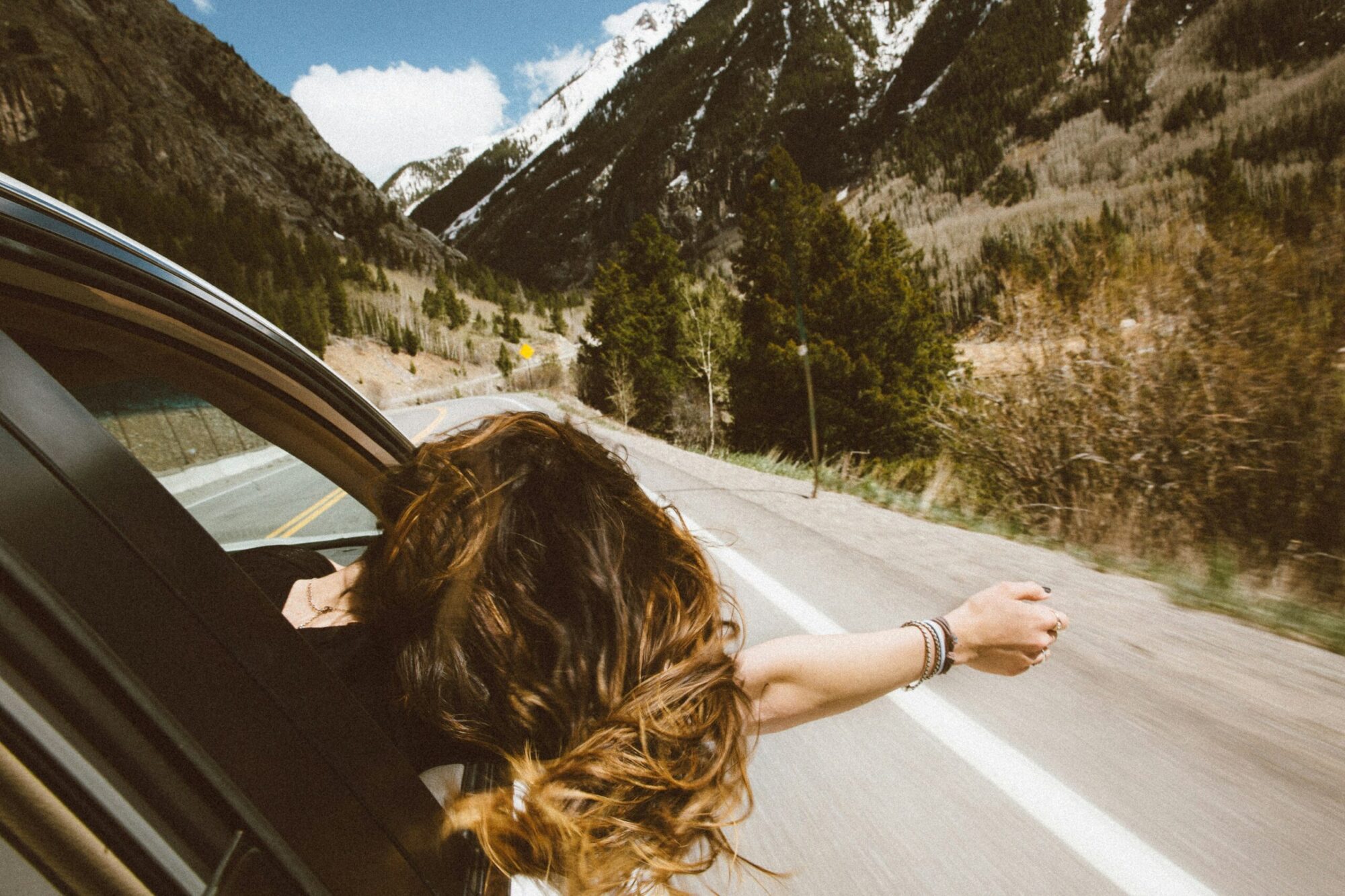 woman on a car road tripping